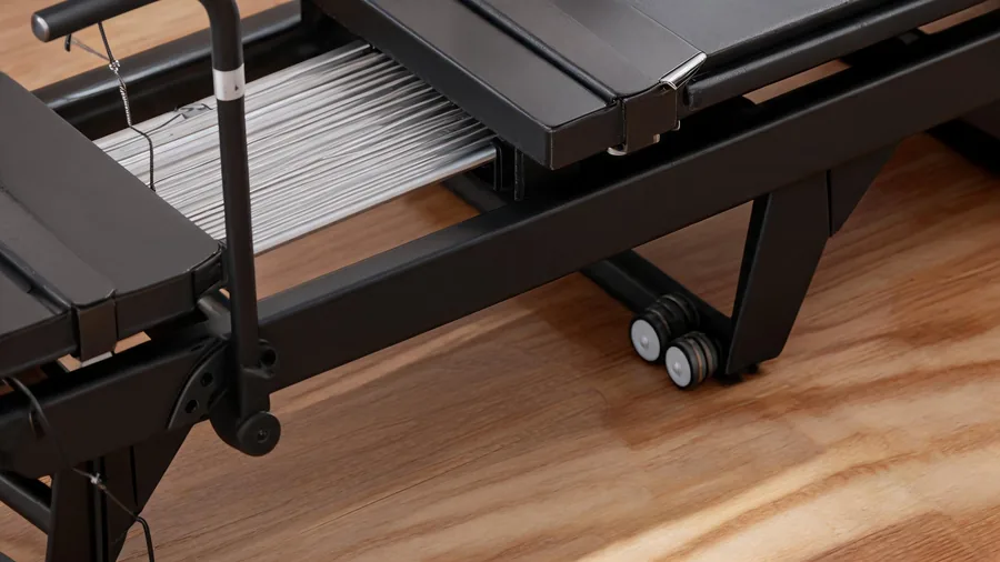 The best pilates reformers for commercial use: steel, springs, and durability 1 Steel frame and rail detail on a commercial pilates reformer