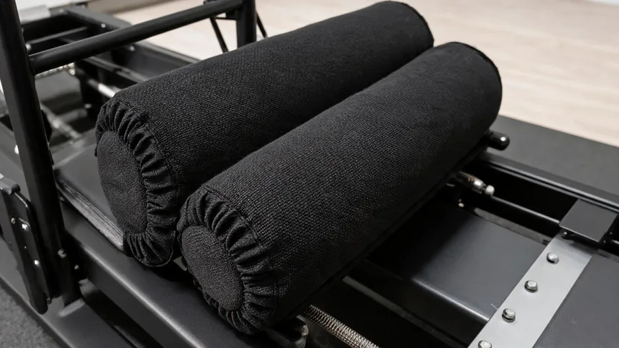 Pilates reformer foam roller covers: hygiene & eco mats 1 Detail of washable fabric covers fitted over foam rollers