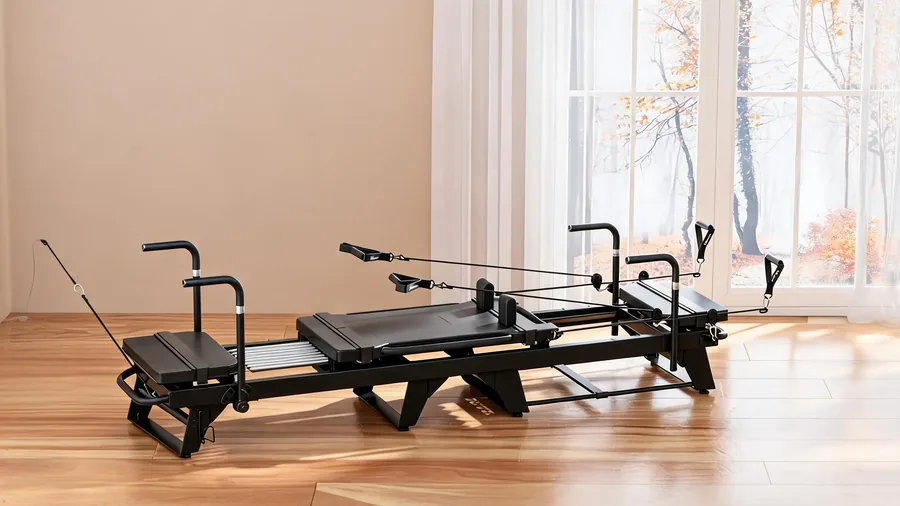 C26 reformers arranged in parallel stations for small group pilates classes
