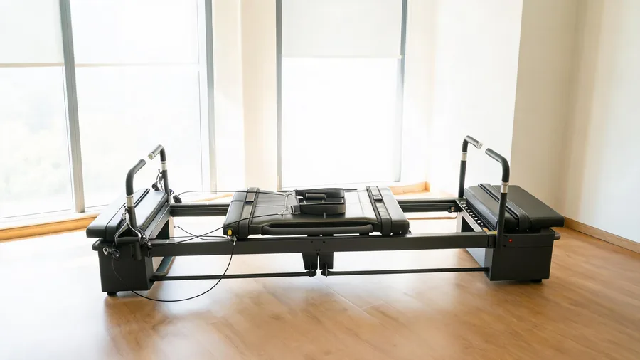 K30 reformer showing its carriage and rail system in a studio