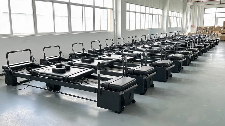 How much does a megaformer cost? Price guide for 2026 1 Commercial reformer production line in a pilates equipment factory