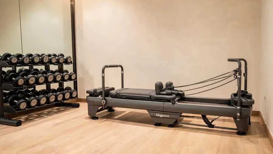 Pilates reformer for hotel fitness centers 1 Detail of a reformer in a compact hotel gym corner