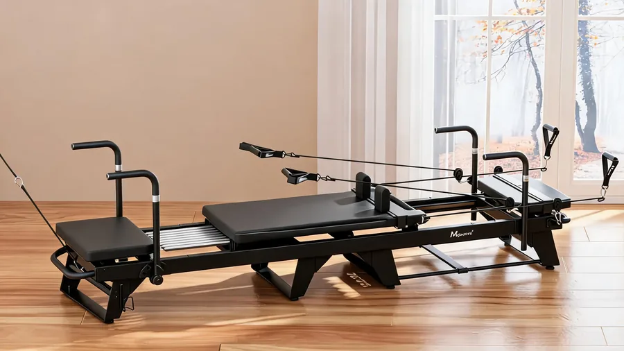 Pilates reformer jump board exercises: adding cardio to your reformer workouts 1 Jump board attached to a pilates reformer with springs in view