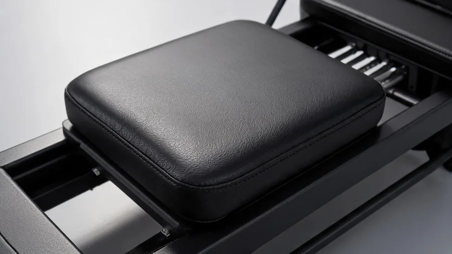 Pilates reformer carriage pad: choosing the right fabric upholstery material 1 Close-up of k30 reformer carriage pad marine vinyl and foam detail