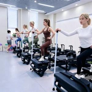 Megacore heavy-duty metal frame commercial Pilates reformer with silent spring system to solve machine noise and broken springs for studios