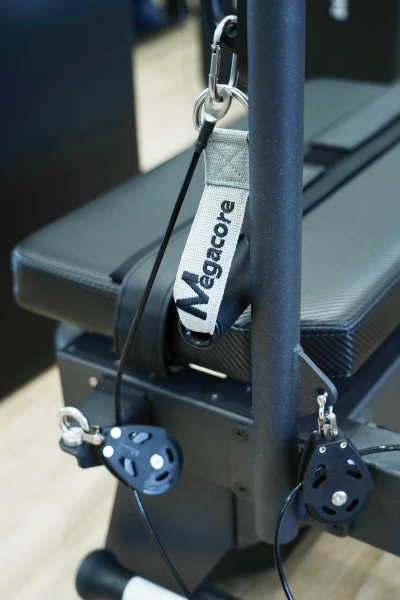 Sealed bearing wheel with nylon raceway on a pilates reformer carriage — quiet maintenance-free glide system